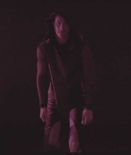 Moody red portrait of a model in avant-garde leather