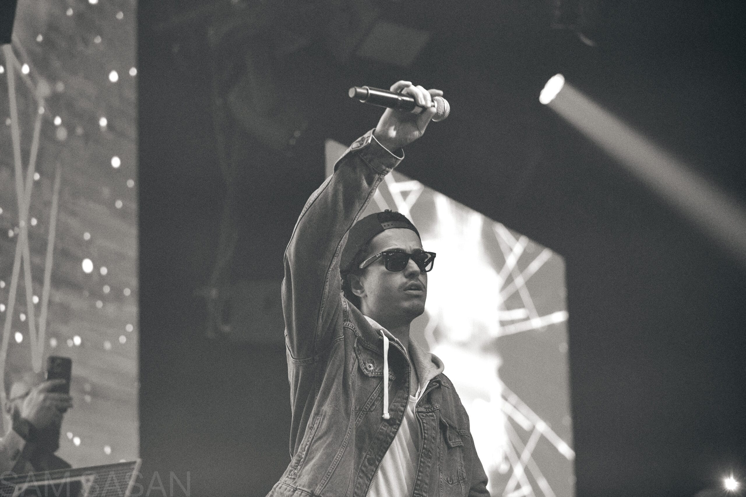 Gritty black and white portrait of a live rap performance
