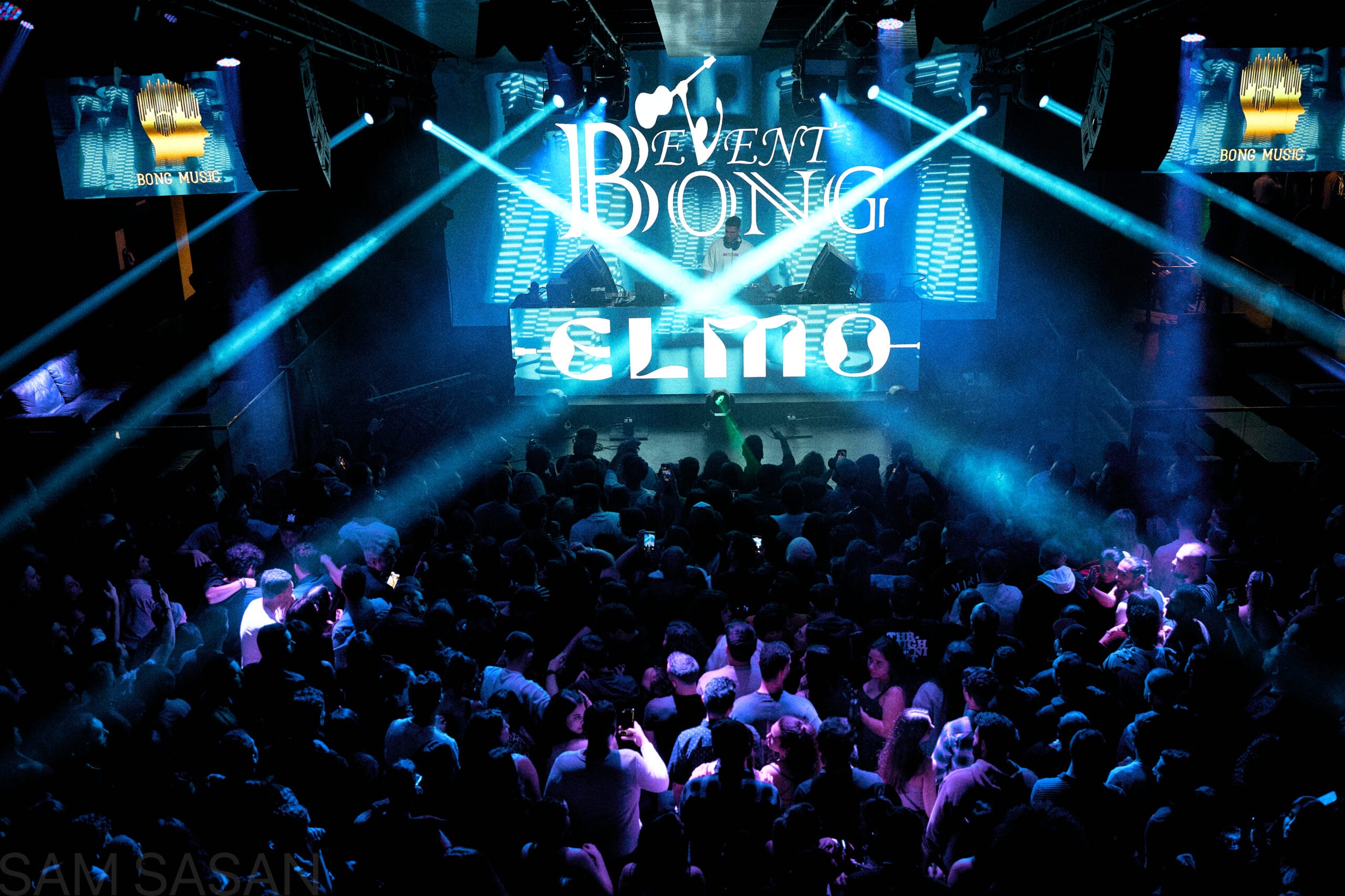 Cinematic lasers shining over a concert crowd