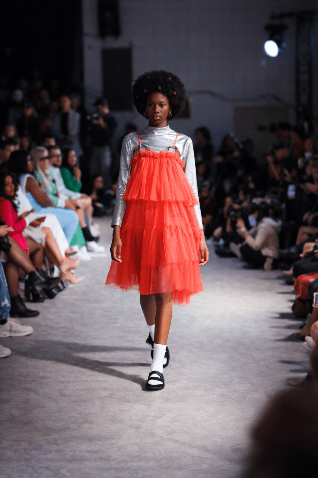 Modern black two-piece outfit with knee-high boots