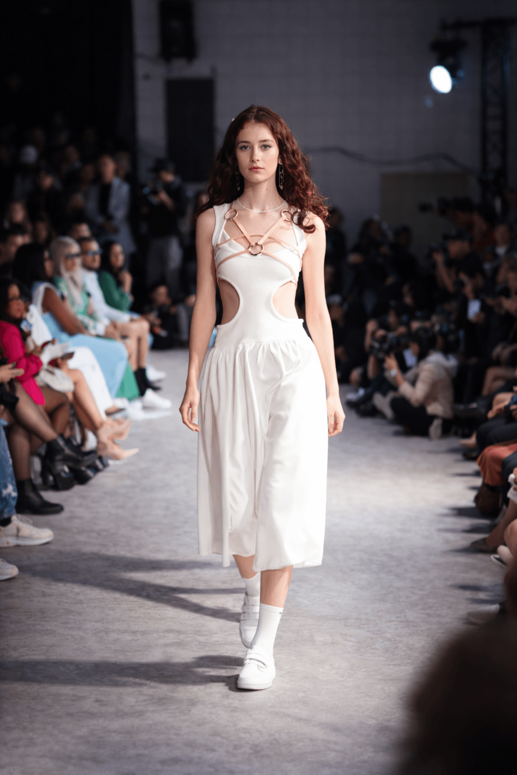 White dress with gold ring cutouts