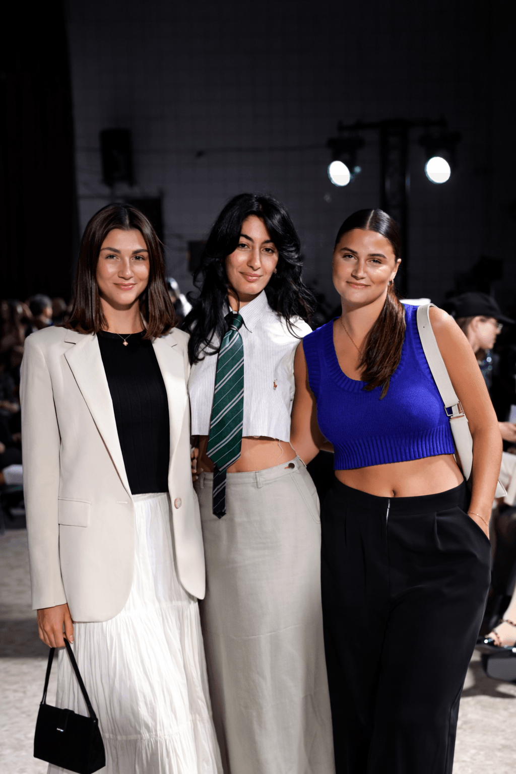 Black and white portrait of a model wearing a dark veil on the runway