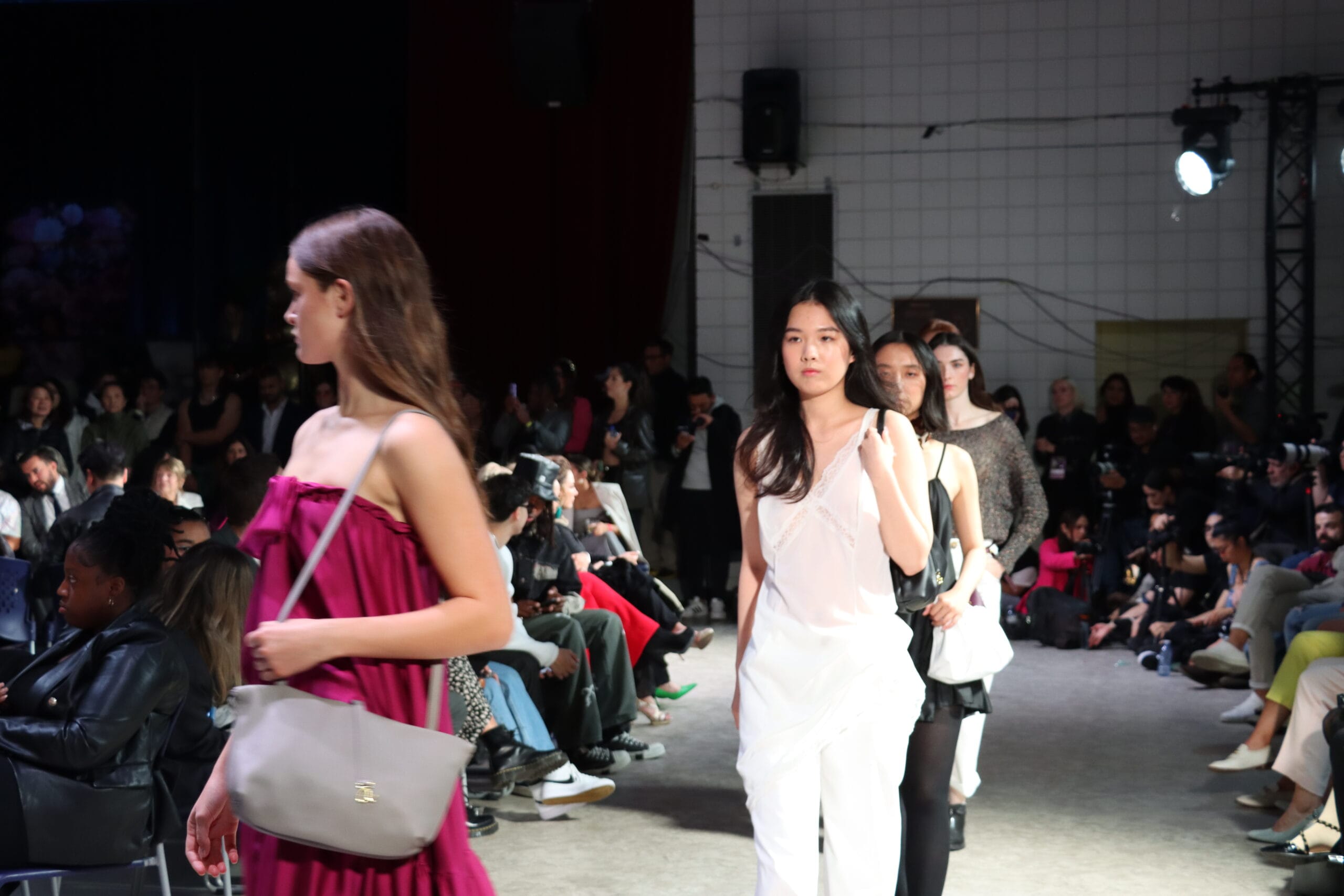 The rhythm of the runway procession showing models in sequence