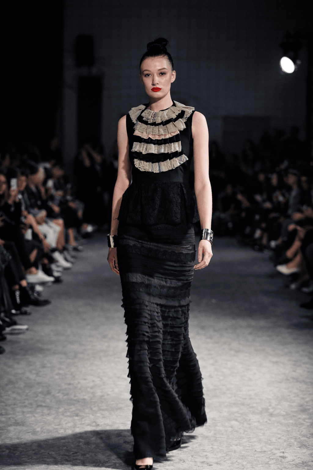 Close-up of sculptural ruffle details on a royal blue fashion garment