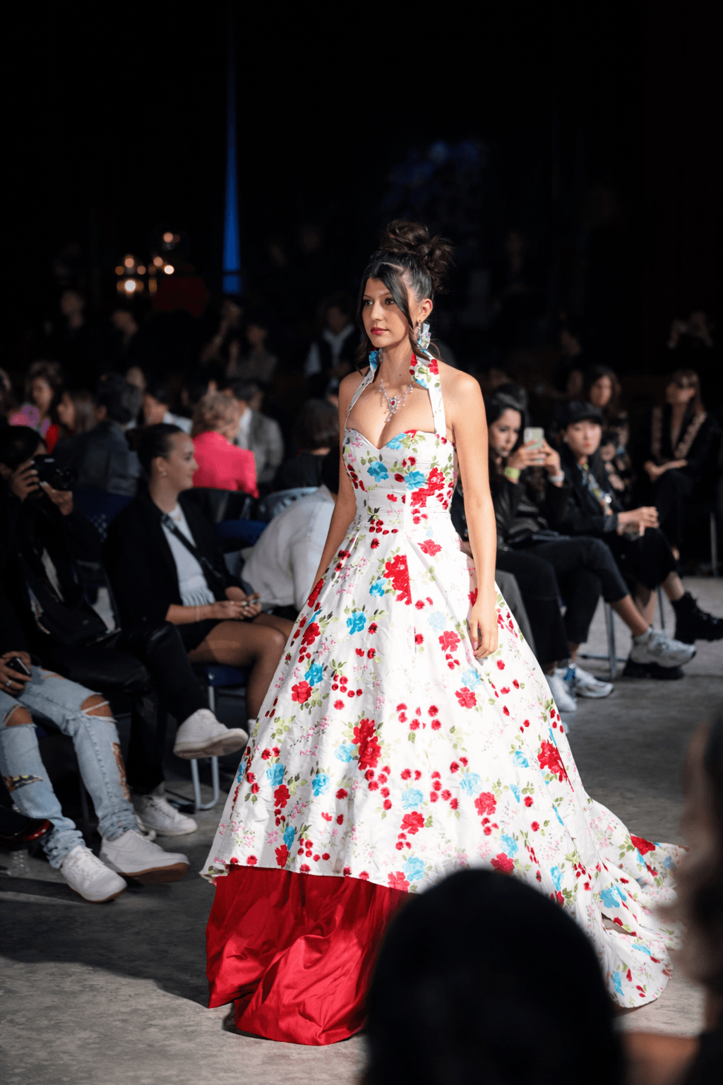 Wide view of Vancouver Fashion Week stage production with bright intersecting lasers