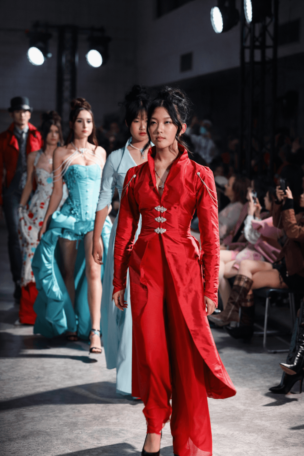 Model walking the runway in a vibrant structured royal blue gown