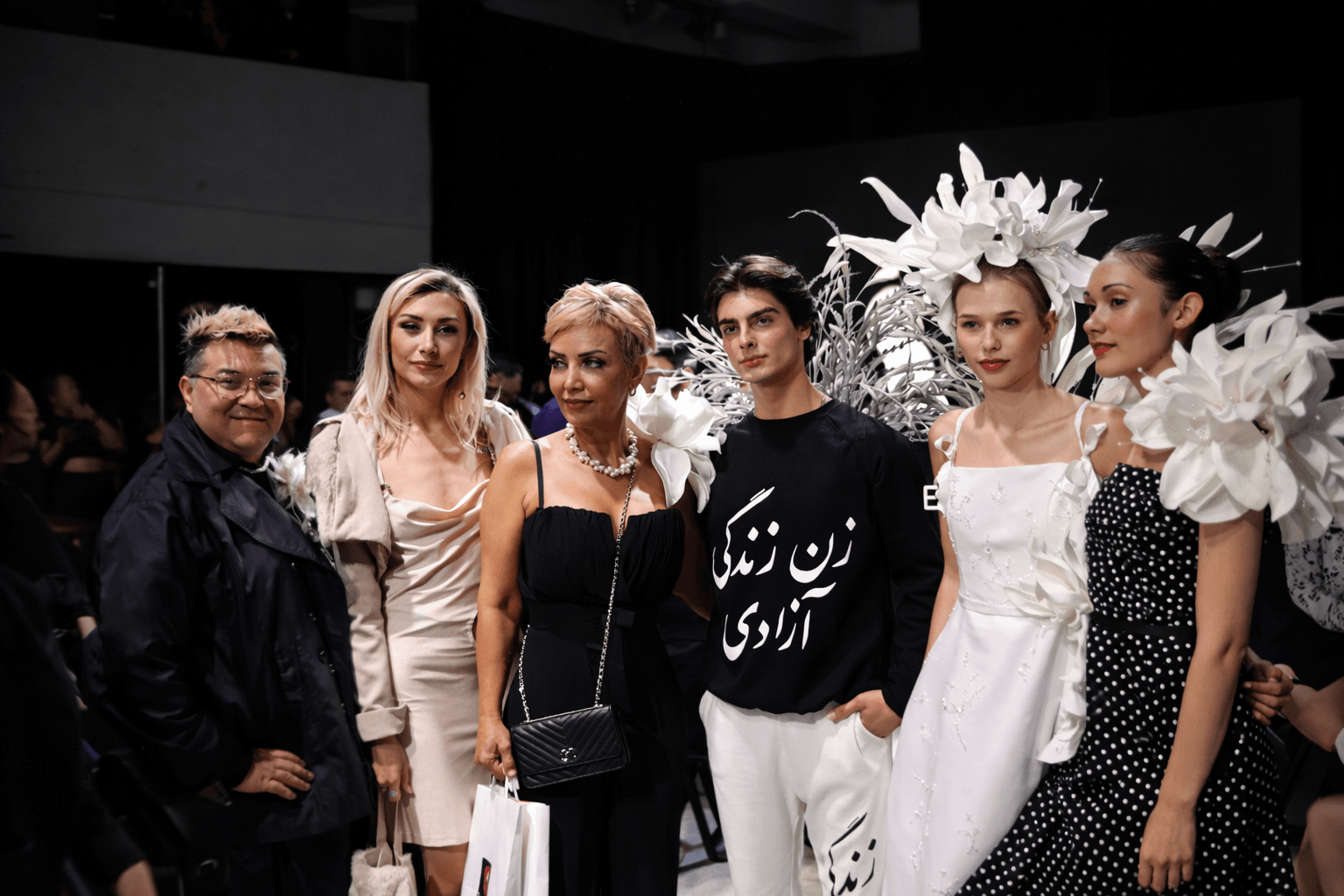 Fashion model posing in front of the official VFW media backdrop