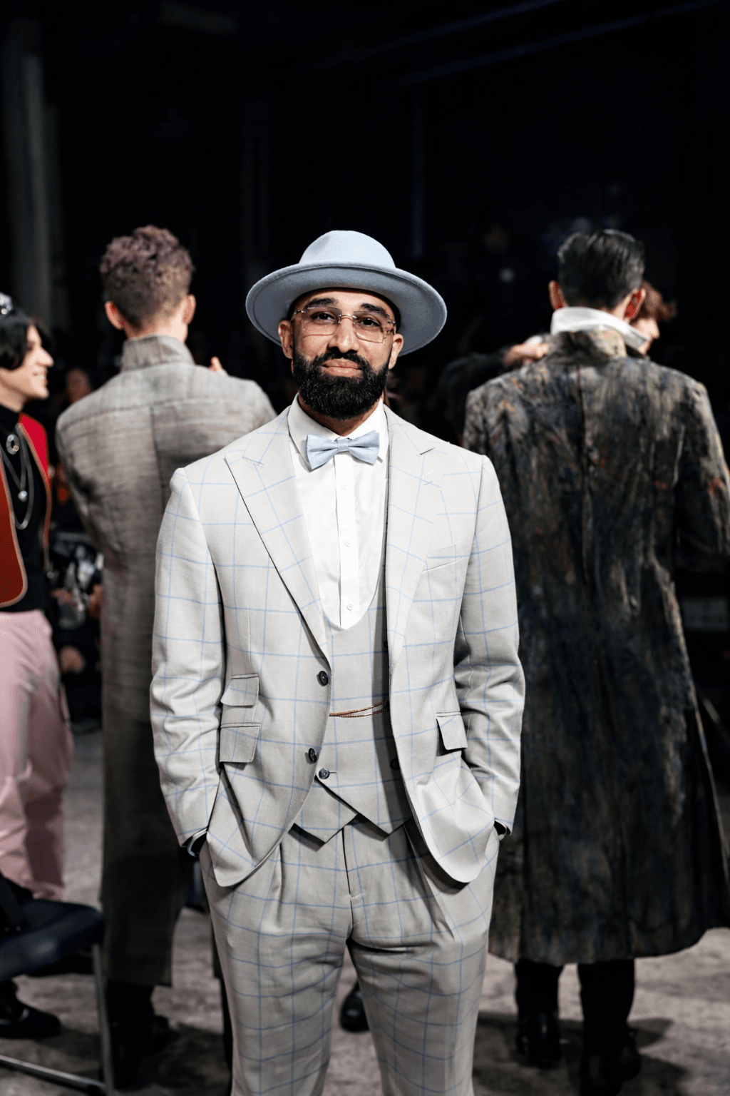 Street style portraits of attendees outside the venue